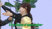 a woman is hugging another woman with the words " a hip display of appreciation " behind her