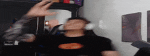 a blurry image of a man wearing headphones