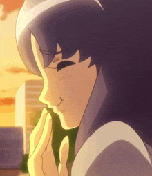 a close up of a girl 's face with a city in the background