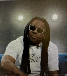 a man wearing sunglasses and a shirt that says 59000
