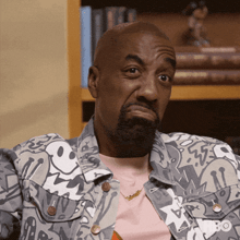 a man with a beard wearing a jacket that says hbo on the front