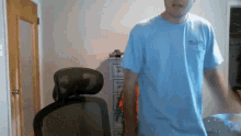 a man wearing a blue shirt that says ' fishing ' on the front