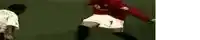 a soccer player in a red shirt and white shorts is kicking the ball