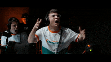 a man wearing headphones and a shirt that says genetics on it