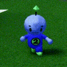 a stuffed animal with the number 2 on it 's shirt is walking on a grassy field .