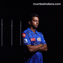 a man wearing a blue shirt that says idfc bank