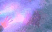 a person is swimming in a pool with a purple light coming out of it