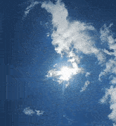 the sun shines brightly through the clouds in a blue sky