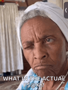 an older woman is making a funny face with the caption what in the actual f $ @ k !