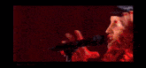 a woman singing into a microphone with the number 12 albania on the bottom right