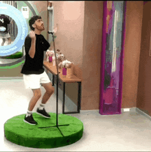 a man is singing into a microphone in front of a argentina sign