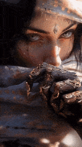 a close up of a woman 's face with a veil on her face