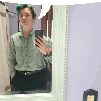 a person taking a selfie in front of a mirror