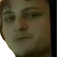 a close up of a man 's face with a very serious look on his face .