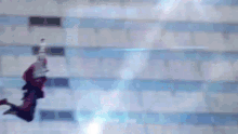 a person is flying through the air with a purple light behind them