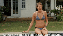 a woman in a bikini is sitting on the edge of a pool asking what day does the pool guy come ?