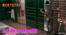 a man is standing in a closet with the words rickystas written on the top