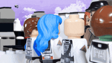 a group of lego figures are standing in a line and one of them has a blue hair