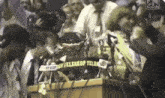 a group of people are gathered around a podium with a sign that says teleskop telekom