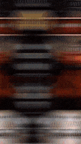 a blurred image of a striped background with a circle in the middle