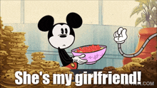 a cartoon of mickey mouse holding a bowl of cereal with the words she 's my girlfriend