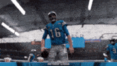 a football player for the detroit lions stands on the field