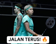 a man and a woman playing badminton with the words jalan terus written below them