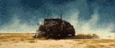 a truck is driving through a desert with smoke coming out of the exhaust pipes