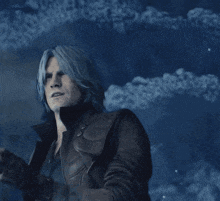 a man with blue hair is wearing a leather jacket and gloves