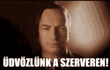 a close up of a man 's face with the words " üdvözlunk a serveren " below it