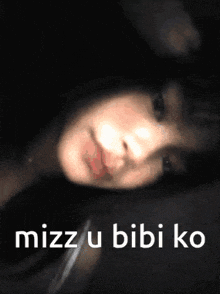 a girl is laying down with the words mizzu bibi ko written on the bottom