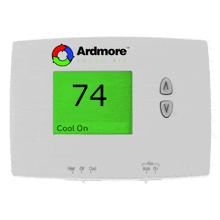 a white ardmore thermostat with a green screen displaying 80 degrees