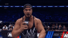 a wrestler says look at me in front of a microphone