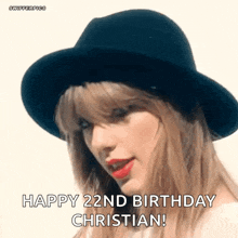 taylor swift is wearing a black hat and red lipstick and wishing christian a happy 22nd birthday