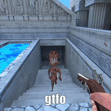 a person holding a gun in front of a staircase that says gtfo on it