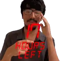 a man with glasses and a beard is holding a digital clock that says hours left