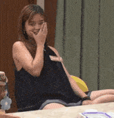 a woman wearing a black tank top that says banca on it