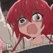 a close up of a girl with red hair making a face