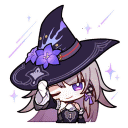 a girl wearing a witch hat with purple flowers on it .