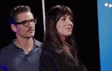 a man and woman are standing next to each other