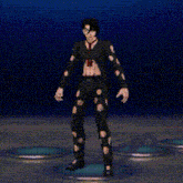 a man in a black suit and tie is waving his hand while standing on a stage .