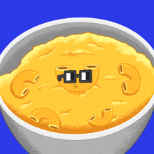 a bowl of macaroni and cheese with a cartoon face
