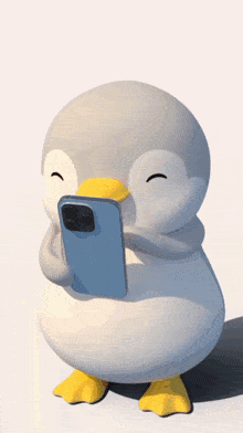 a penguin is holding a cell phone in its beak