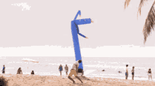 Wind Sock Man Beach GIF - Wind Sock Man Beach Having Fun GIFs
