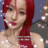 a woman with red hair is surrounded by hearts and says " mi cara cuando soy de alee 3 "