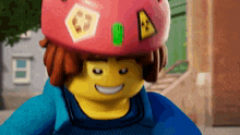 a lego man wearing a red helmet with a triangle on it