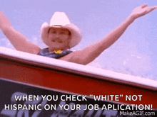 a man in a cowboy hat is waving his arms in the air