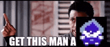 a man is pointing at a pixelated image of a man with the words `` get this man a '' written on it .