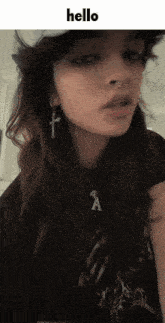 a girl wearing a hat and a necklace with the word hello above her