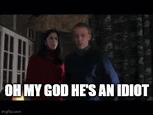 a man and a woman are standing next to each other and the man is saying " oh my god he 's an idiot "